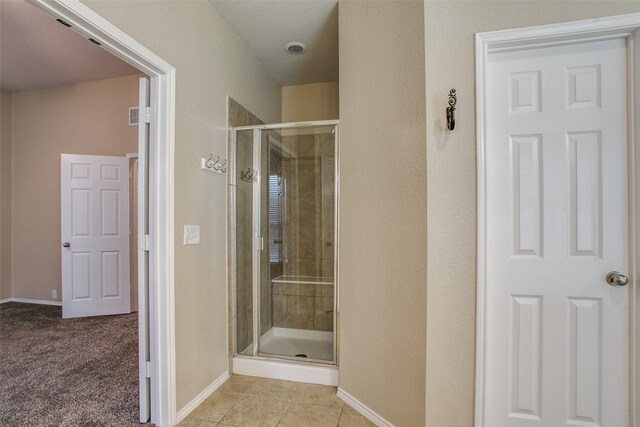 2501 Del Largo Way, Frisco, TX 75033 - full bathroom with baseboards, a stall shower, and tile patterned floors