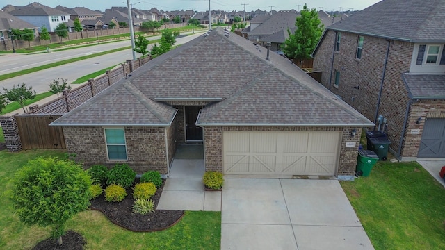 6000 Sutton Fields Trl, Celina, TX 76227 - view of front of home featuring brick siding, a residential view, fence, and a shingled roof