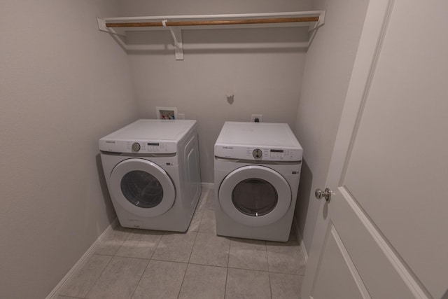 6000 Sutton Fields Trl, Celina, TX 76227 - clothes washing area with light tile patterned floors, baseboards, laundry area, and washing machine and dryer