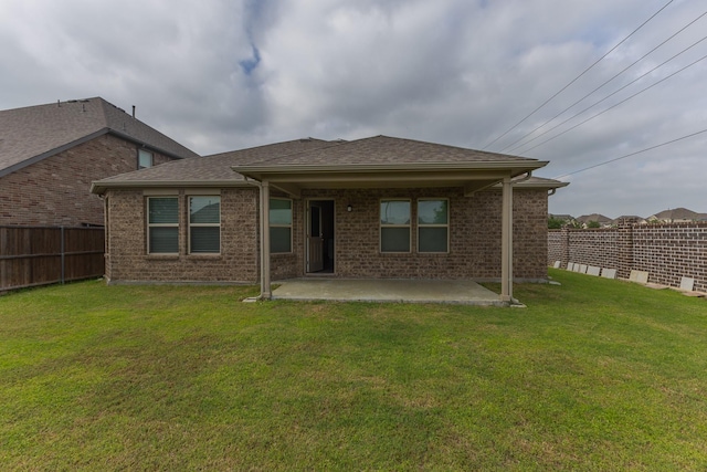 6000 Sutton Fields Trl, Celina, TX 76227 - back of property featuring a fenced backyard, a patio, a lawn, and brick siding