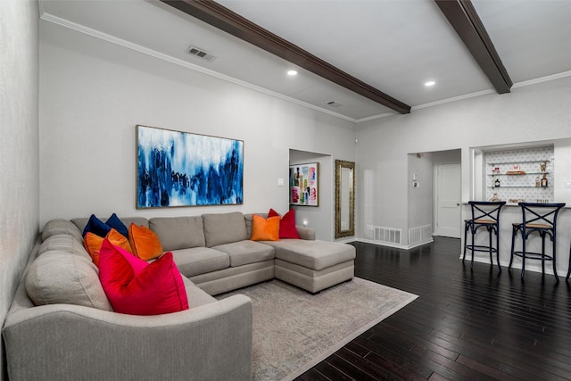living room featuring visible vents, ornamental molding, beam ceiling, and wood finished floors