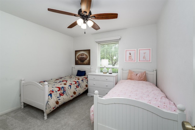 bedroom featuring light carpet and a ceiling fan