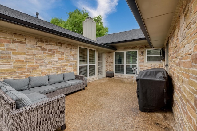 view of patio featuring outdoor lounge area and a grill