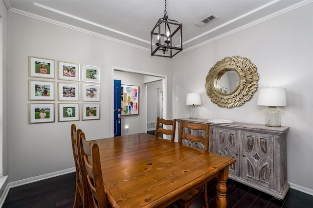 dining area featuring baseboards, an inviting chandelier, dark wood-style floors, and ornamental molding