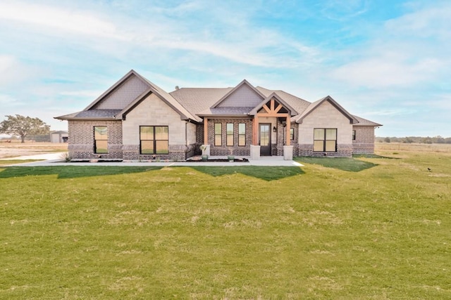 170 Rolling Hills Blvd, Alvord, TX 76225 - rear view of house with a yard, brick siding, and stone siding