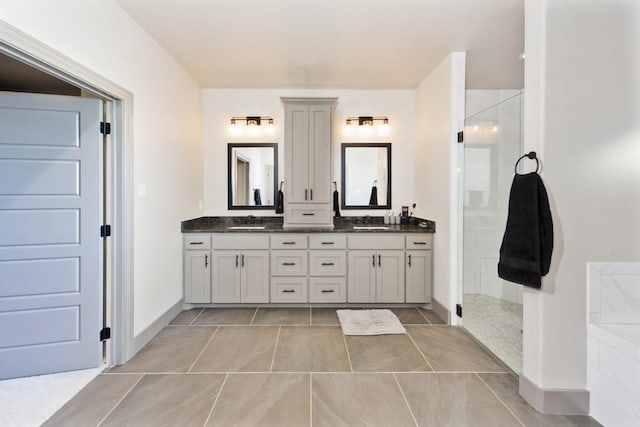 170 Rolling Hills Blvd, Alvord, TX 76225 - full bathroom featuring double vanity, tile patterned floors, a shower stall, and a sink