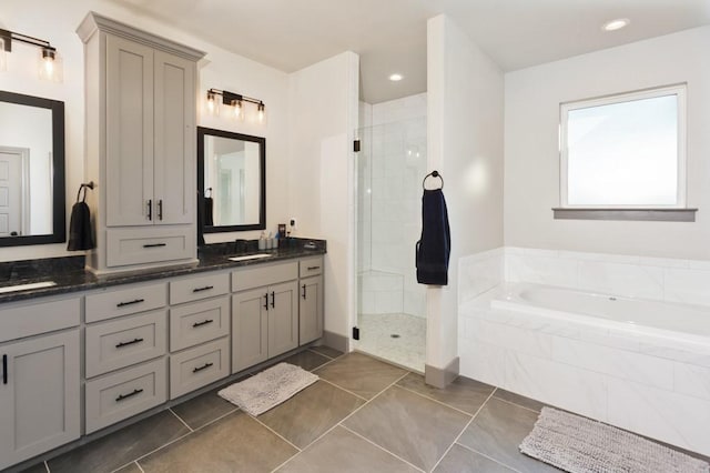 170 Rolling Hills Blvd, Alvord, TX 76225 - bathroom featuring a garden tub, double vanity, a stall shower, and tile patterned floors