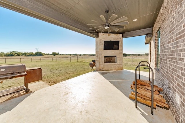 170 Rolling Hills Blvd, Alvord, TX 76225 - view of patio featuring an outdoor stone fireplace, ceiling fan, fence, and area for grilling