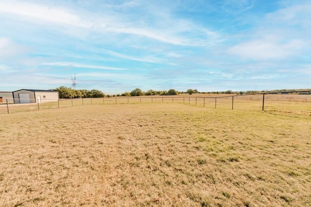 170 Rolling Hills Blvd, Alvord, TX 76225 - view of yard featuring a garage, fence, and a rural view