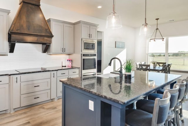 170 Rolling Hills Blvd, Alvord, TX 76225 - kitchen with appliances with stainless steel finishes, tasteful backsplash, a sink, custom range hood, and recessed lighting