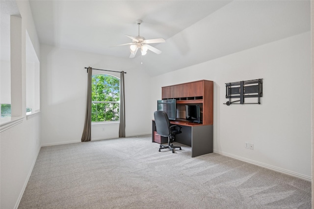 home office with ceiling fan, light carpet, baseboards, and lofted ceiling