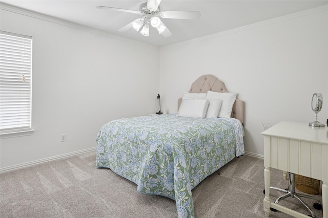 bedroom with a ceiling fan, baseboards, ornamental molding, and carpet