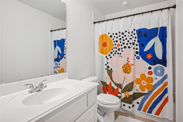 full bathroom featuring tile patterned floors, vanity, toilet, and curtained shower
