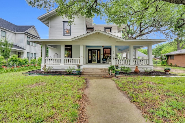 view of front of property with a porch and a front lawn