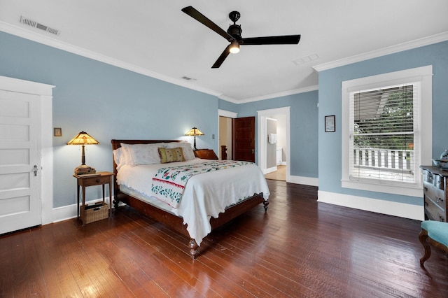 bedroom featuring visible vents, ornamental molding, wood-type flooring, baseboards, and ceiling fan
