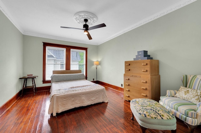 bedroom featuring baseboards, a ceiling fan, crown molding, and hardwood / wood-style floors