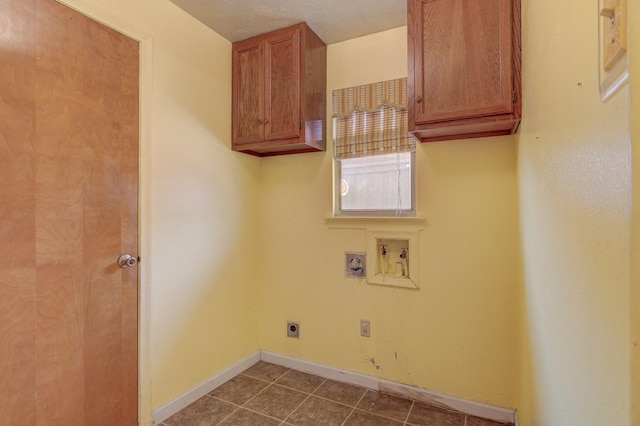 clothes washing area featuring cabinet space, washer hookup, baseboards, and electric dryer hookup