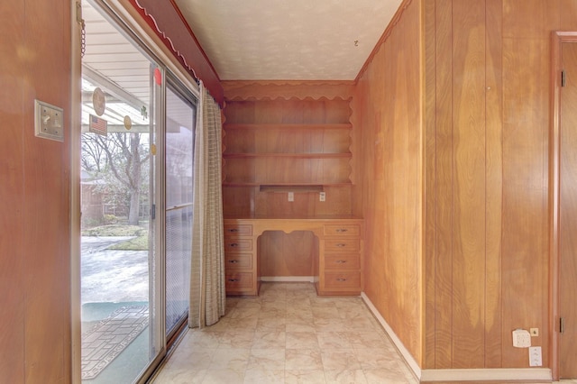 corridor featuring baseboards