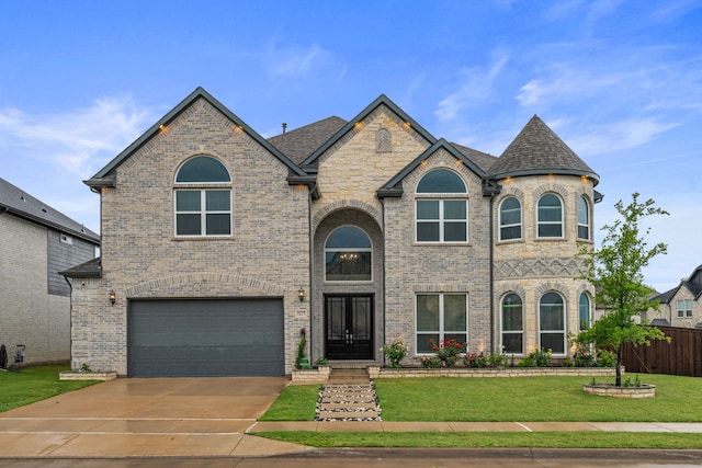 5617 Winona Ln, Mckinney, TX 75071 - french country inspired facade with an attached garage, concrete driveway, brick siding, and roof with shingles