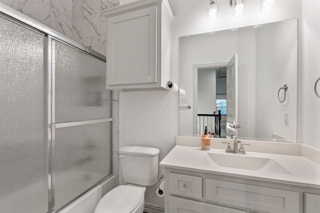 5617 Winona Ln, Mckinney, TX 75071 - bathroom featuring toilet, combined bath / shower with glass door, and vanity