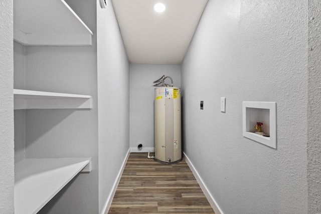 laundry room with washer hookup, laundry area, gas water heater, hookup for an electric dryer, and dark wood-style floors