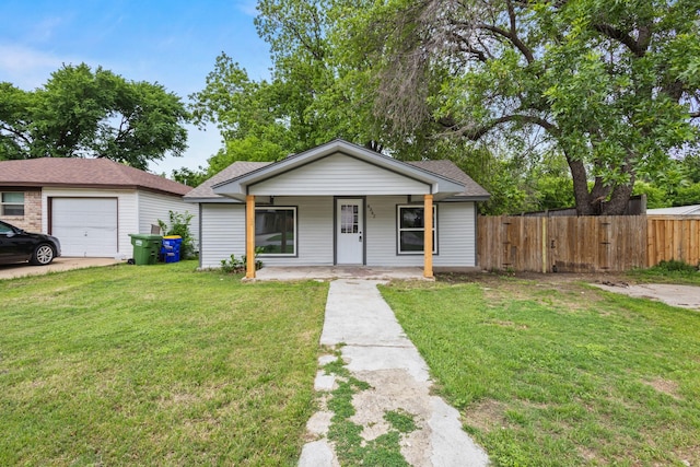 bungalow featuring fence, a porch, and a front lawn