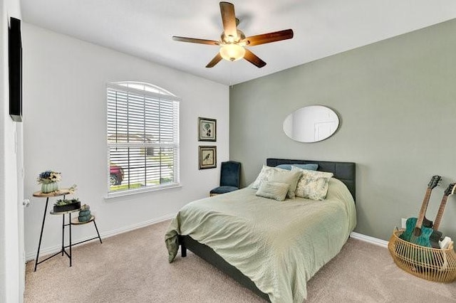 bedroom featuring baseboards, carpet, and ceiling fan