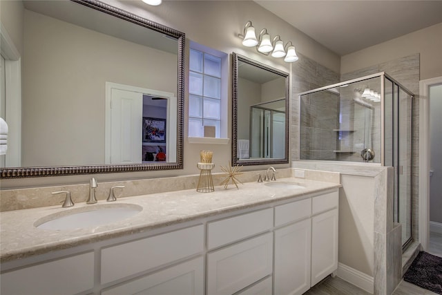 7401 Collin Mckinney Pkwy, Mckinney, TX 75070 - full bathroom featuring a shower stall and double vanity