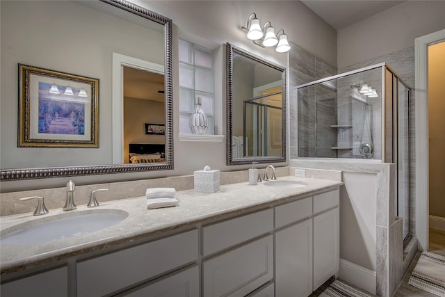 7401 Collin Mckinney Pkwy, Mckinney, TX 75070 - bathroom with a shower stall and double vanity