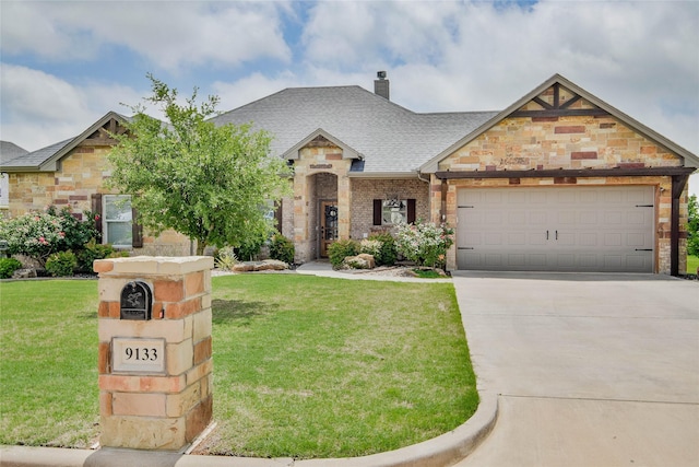 french country inspired facade with a garage, roof with shingles, a front yard, and concrete driveway