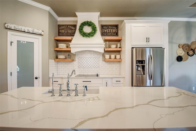 kitchen featuring stainless steel fridge with ice dispenser, ornamental molding, open shelves, and black electric cooktop