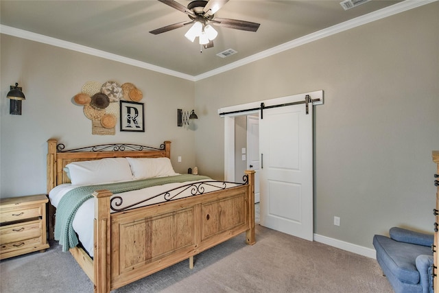 bedroom featuring visible vents, crown molding, light carpet, baseboards, and a barn door