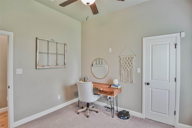 office area featuring baseboards, a ceiling fan, and carpet flooring