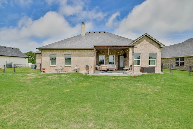 back of property featuring fence, a chimney, outdoor lounge area, and brick siding