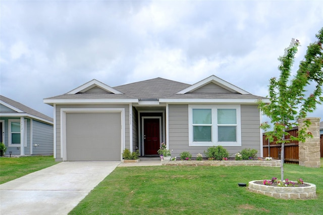ranch-style house featuring a front yard, fence, concrete driveway, an attached garage, and a shingled roof