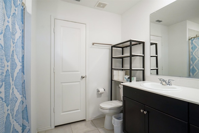 bathroom with vanity, tile patterned flooring, toilet, and visible vents