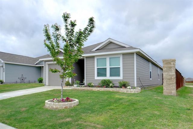 ranch-style house featuring a garage, a front yard, and concrete driveway