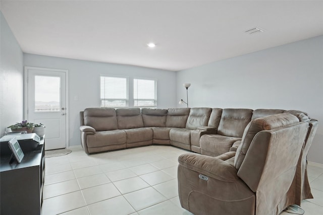 living room featuring visible vents and light tile patterned flooring