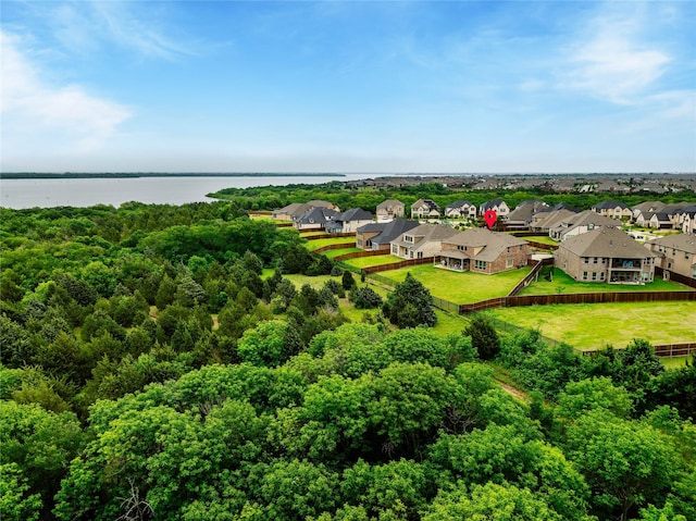 birds eye view of property featuring a residential view and a water view