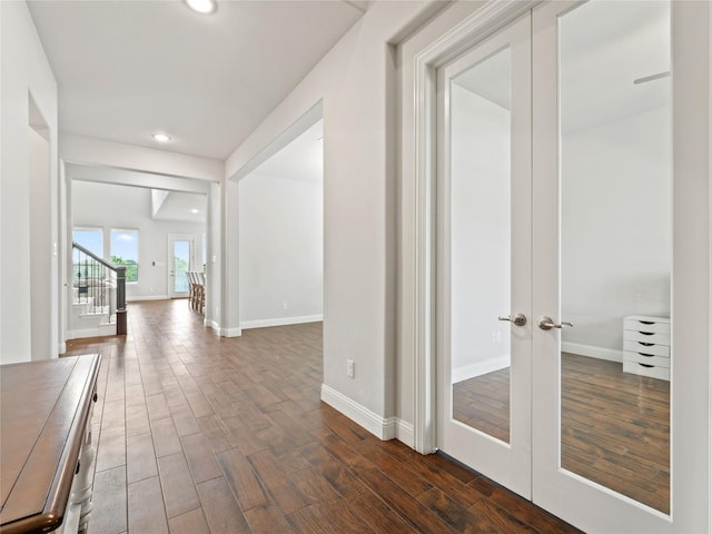 corridor with recessed lighting, baseboards, french doors, and dark wood-style floors