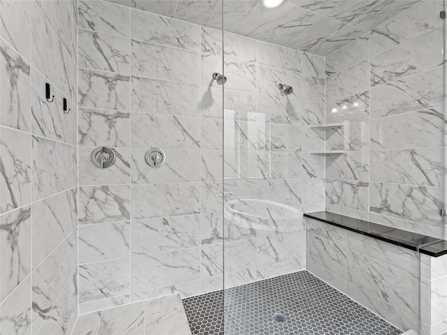 bathroom with recessed lighting and tiled shower