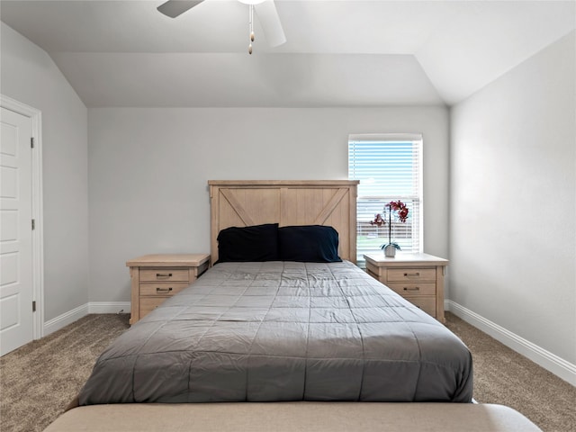 carpeted bedroom featuring baseboards, a ceiling fan, and vaulted ceiling