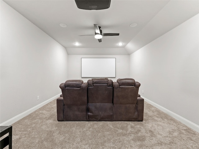 carpeted home theater featuring baseboards and ceiling fan