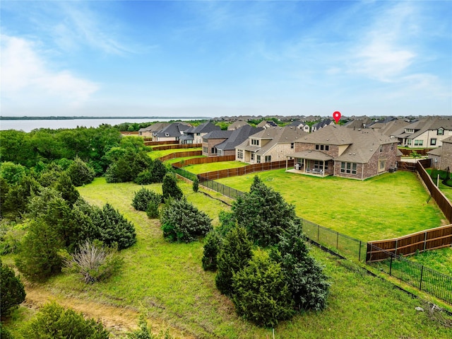 birds eye view of property featuring a water view and a residential view