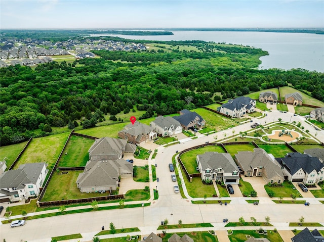 birds eye view of property with a water view and a residential view
