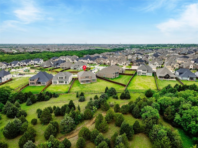 birds eye view of property with a residential view