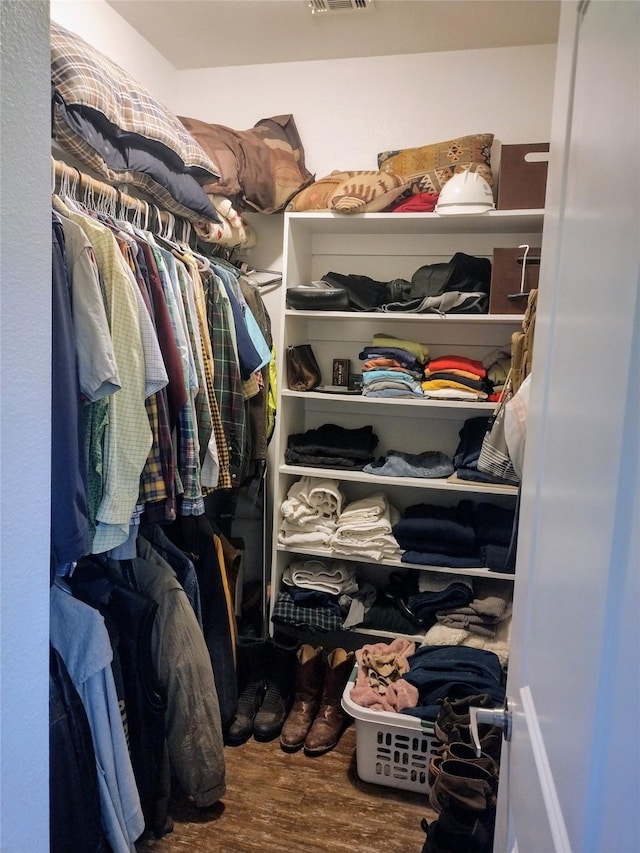 spacious closet with visible vents and wood finished floors