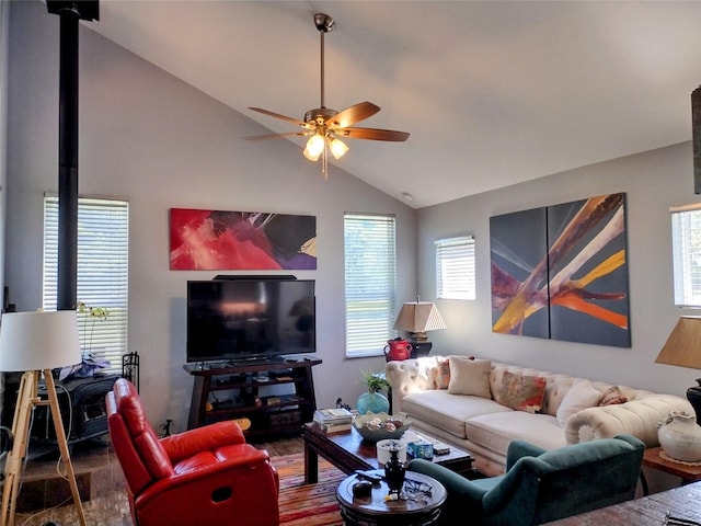 living area featuring wood finished floors, ceiling fan, lofted ceiling, and a wealth of natural light