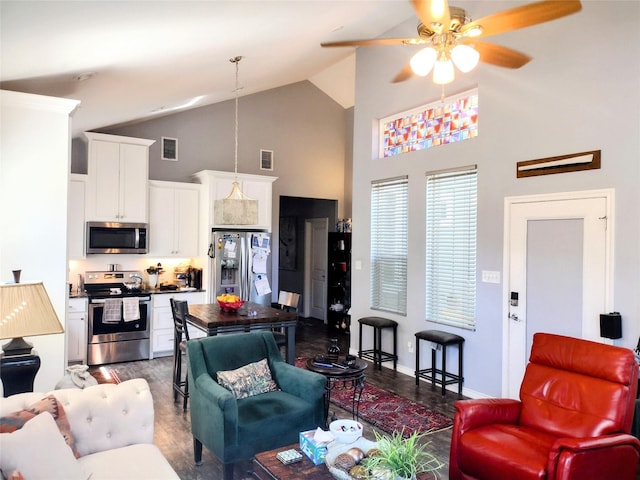 living area featuring a ceiling fan, high vaulted ceiling, visible vents, and wood finished floors