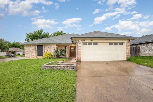 single story home featuring concrete driveway, brick siding, a front yard, and a garage